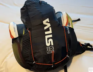 Image may contain Bag Backpack Clothing Coat and Jacket