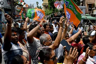 Bharatiya Janata Party (BJP) supporters celebrate along a street near the residence of West Bengal chief minister and All India Trinamool Congress (TMC) party chairperson Mamata Banerjee, in Kolkata on May 4, 2026 during vote counting for the West Bengal Legislative Assembly elections.