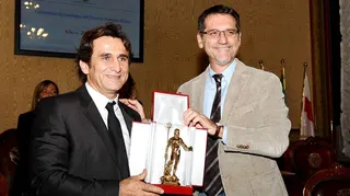 Alex Zanardi, left, awarded with the Nettuno d'Oro by the Mayor of Bologna Virginio Merola