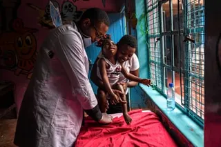 An African man and a woman with a small child