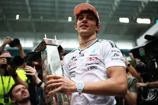 Kimi Antonelli celebrates with his trophy after winning his third race in a row. Photo: AFP