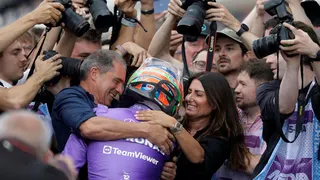 Kimi Antonelli hugging his mother, Veronica and father, Marco after winning the Miami Grand Prix