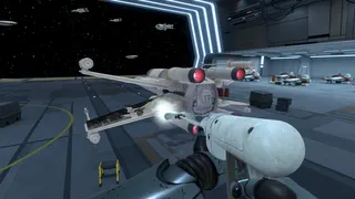 A robot cleaning an X-Wing in PowerWash Simulator 2's Star Wars pack.