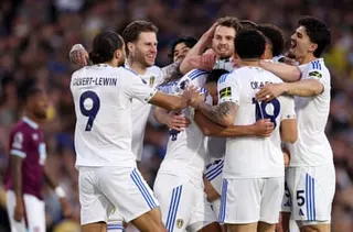 Anton Stach is embraced by his Leeds teammates after scoring against Burnley.