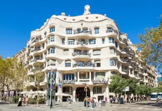 The memorable front entrance of Casa Milà, on a sunny day