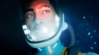 Close-up image from Subnautica 2's cinematic trailer showing a deep sea diver underwater as an emergency warning flashes on his helmet's display.