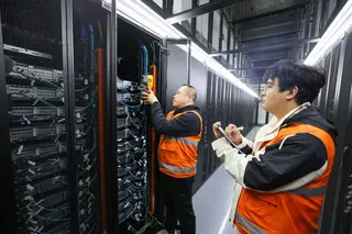 Engineers measure and record the temperature of servers on a digital technology industrial estate in Tianjin, on February 26. Photo: Xinhua