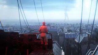 A scientist looks out at a city.
