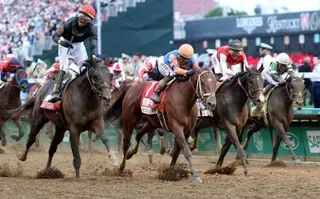 Golden Tempo (left), ridden by jockey Jose Ortiz, crosses the finish line to win the 152nd Kentucky Derby. Photo: Getty Images