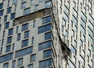 The damaged facade of a high-rise building in Moscow