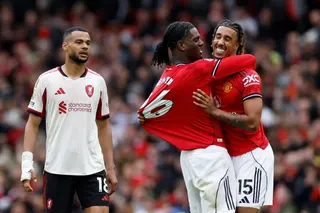 Soccer Football - Premier League - Manchester United v Liverpool - Old Trafford, Manchester, Britain - May 3, 2026 Manchester United's Ayden Heaven and Leny Yoro celebrate as Liverpool's Cody Gakpo looks dejected after the match Action Images via Reuters/Jason Cairnduff EDITORIAL USE ONLY. NO USE WITH UNAUTHORIZED AUDIO, VIDEO, DATA, FIXTURE LISTS, CLUB/LEAGUE LOGOS OR 'LIVE' SERVICES. ONLINE IN-MATCH USE LIMITED TO 120 IMAGES, NO VIDEO EMULATION. NO USE IN BETTING, GAMES OR SINGLE CLUB/LEAGUE/P