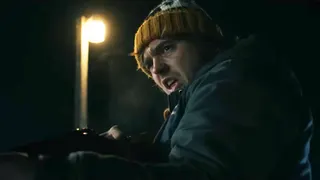 The protagonist holding a gun.