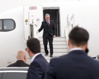 Starmer disembarking a plane