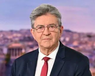 Mélenchon in a blue suit and red tie