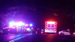 Police cars and an ambulance at the scene of the shooting in Arcadia Lake.