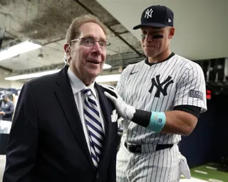 Yankees star Aaron Judge greets John Sterling before a game in 2024
