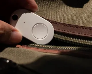 Person holding GPS tracker