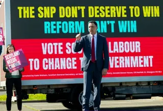Anas Sarwar unveiling a Scottish Labour election poster today.