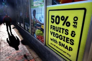 a person walking by a sign