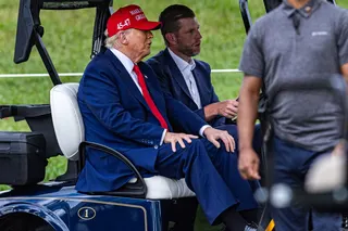 US President Donald Trump and his son Eric Trump drive in a golf cart during previews for LIV Golf Miami at Trump National Doral Miami on April 03, 2025. — AFP pic