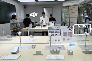 Empty display stands for drones are seen at a DJI store in a mall in Beijing on April 29. Photo: AFP