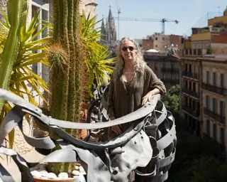 Ana Viladomiu standing on her balcony