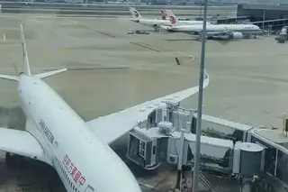 A China Eastern Airbus A350-900 struck a jet bridge with its wing as it approached a gate at Shanghai Hongqiao International Airport on Saturday morning. Photo: Weibo