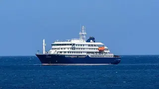 AFP via Getty Images The blue and white cruise ship MV Hondius stationary in the ocean off the port of Praia, the capital of Cape Verde.