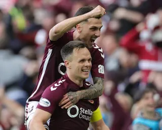 Alexandros Kyziridis celebrates with Lawrence Shankland