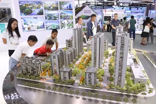 Property models are displayed at the China International Fair for Trade in Services in Beijing on September 14, 2025. Photo: VCG via Getty Images