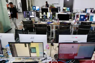Cambodian authorities display equipment at an alleged online scam operation at a condominium in Phnom Penh, Cambodia, on March 11. Photo: EPA