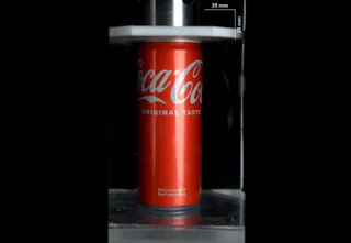Soda can in a hydraulic press