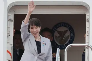 Japan’s Prime Minister Sanae Takaichi waves as she departs on an official trip to Vietnam and Australia, at Haneda Airport in Tokyo on Friday. Photo: AFP