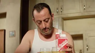 Jean Reno in Leon the Professional with a carton of milk