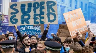 Fans outside Stamford Bridge protest against the proposed European Super League in 2021.