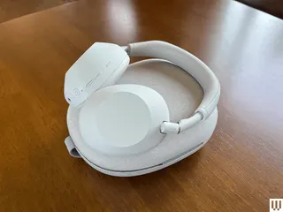 Image may contain Electronics Headphones Dining Table Furniture and Table