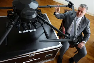 Ukraine’s Ambassador to Japan Yurii Lutovinov poses next to a mockup of a Ukrainian-made Vampire drone during an interview at the Ukraine Embassy in Tokyo, Japan on Tuesday. Photo: Reuters