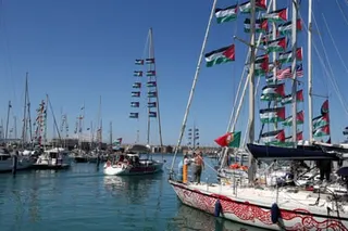 Boats belonging to the global sumud flotilla leave the marina in Augusta, Sicily last week.