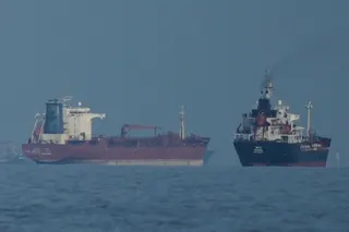 Oil tankers and cargo ships line up in the Strait of Hormuz off Khor Fakkan, United Arab Emirates, on March 11. Photo: AP