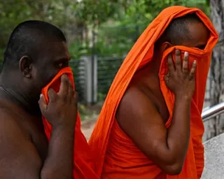 Sri Lankan monks arrive to appear before a court