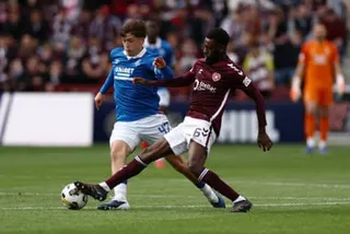Beni Baningime nicks the ball from Mikey Moore.