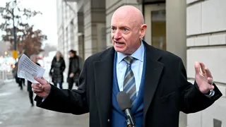 Sen. Mark Kelly speaking to media outside federal court in Washington D.C.
