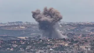 EPA Smoke rises after an Israeli strike on a village in southern Lebanon, as seen from northern Israel (12 May 2026)