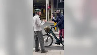 Benedict Cumberbatch arguing with a masked cyclist on St Pancras Road in London