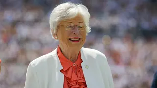 Alabama Gov. Kay Ivey standing on football field during halftime at Jordan-Hare Stadium