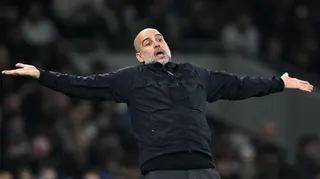 Pep Guardiola with his arms held out in a questioning gesture