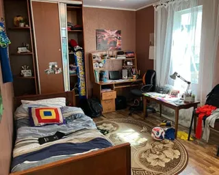A close up of an art installation of a Ukrainian child’s empty bedroom