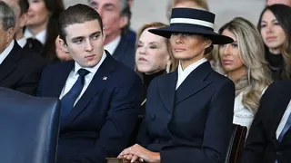 Barron Trump and Melania Trump listening to President Donald Trump in U.S. Capitol Rotunda