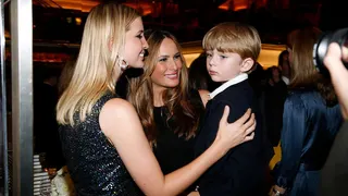 Ivanka Trump, Melania Trump and Barron Trump standing together at Trump Tower.