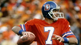 Quarterback Craig Morton dropping back to pass during an NFL game at Mile High Stadium